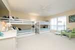 The kids room or adults has 4 twin bunk beds and 2 twin trundle beds for a total of 6 beds